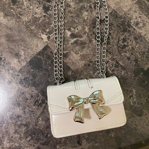 Silver and white bow purse